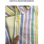 Image of our trousers with crotch reinforcement - image shows a finger pointing to a simple stitch on the garment which shows how the crotch reinforcement looks from the outside.