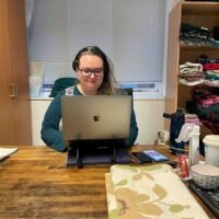 Reservations - Alice at desk